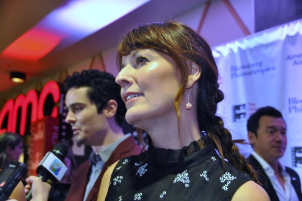 Rosemarie DeWitt of "La La Land" is interviewed on the Red Carpet in Chicago, with Writer/Director Damien Chazelle in the background.