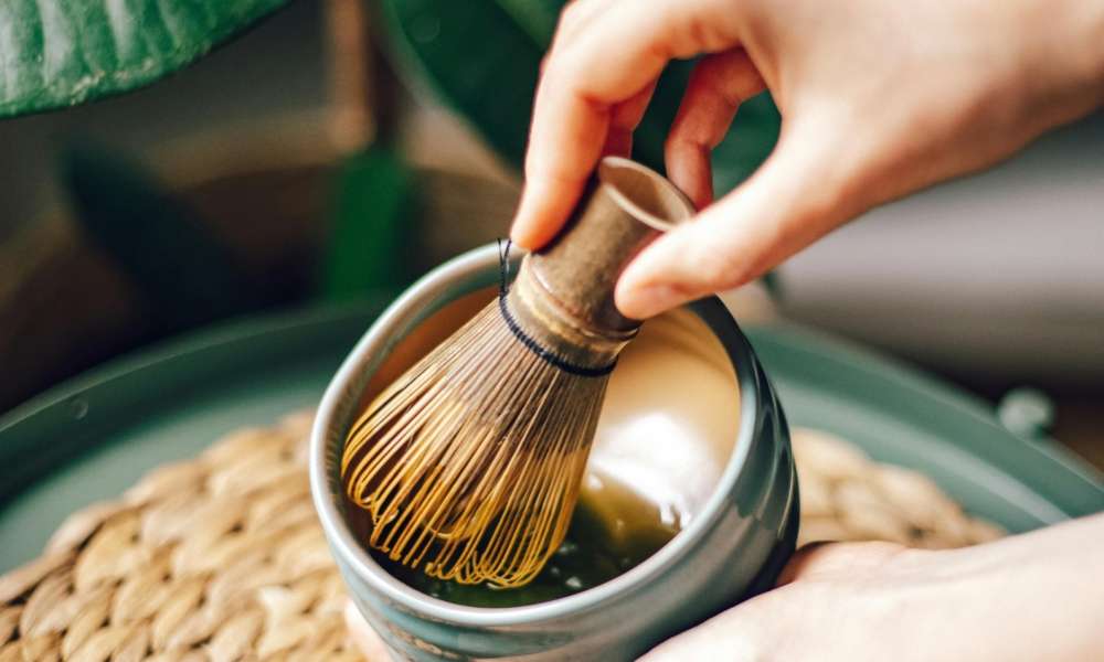 Person Holding Whisk